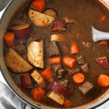 Overhead shot of dutch oven beef stew with potatoes and carrots