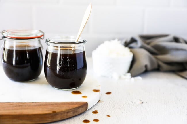 DIY coconut aminos substitute in two jars with rice in background horizontal image
