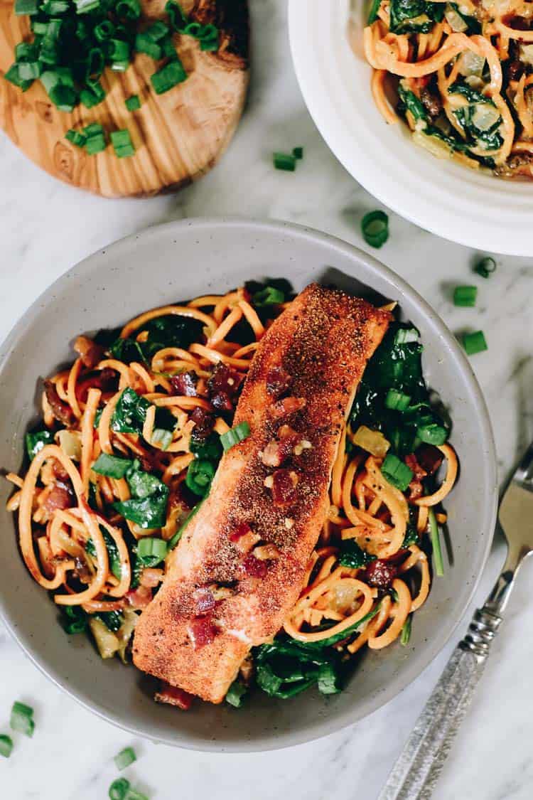 Creamy salmon sweet potato noodle bowls overhead two bowls with fork