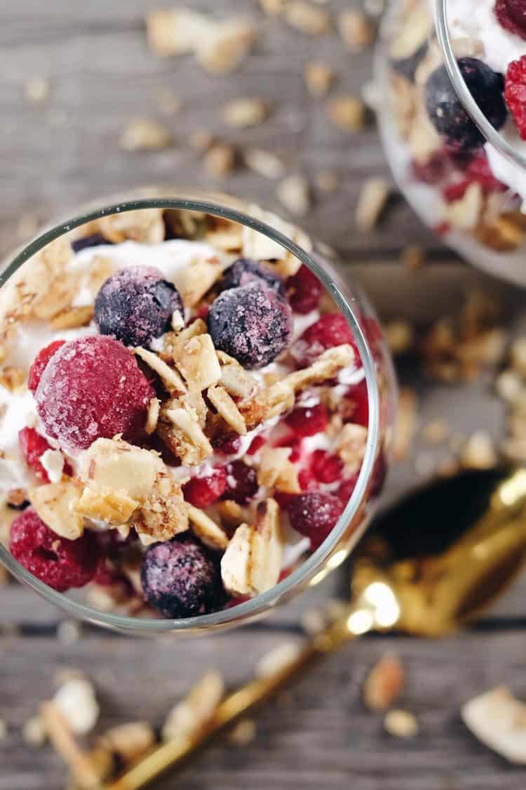 This creamy breakfast parfait is filled with healthy fats from the coconut milk, antioxidant rich berries and grain free granola to add a little crunch. Paleo, Gluten-Free, Grain-Free, Dairy-Free + Refined Sugar-Free. | realsimplegood.com