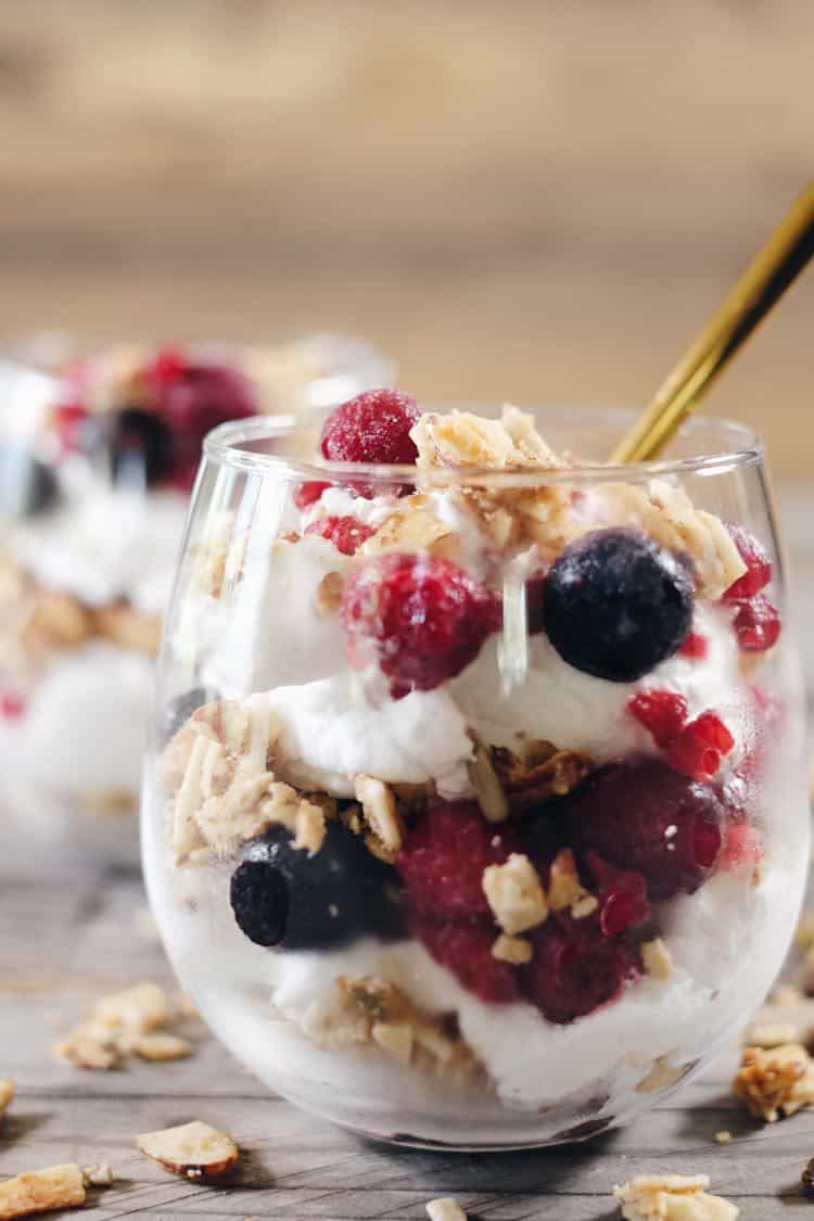 This creamy breakfast parfait is filled with healthy fats from the coconut milk, antioxidant rich berries and grain free granola to add a little crunch. Paleo, Gluten-Free, Grain-Free, Dairy-Free + Refined Sugar-Free. | realsimplegood.com