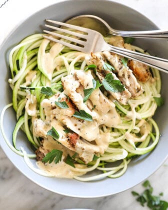 Creamy chicken alfredo with zoodles and spoon and fork