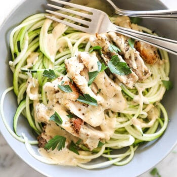 Creamy chicken alfredo with zoodles and spoon and fork