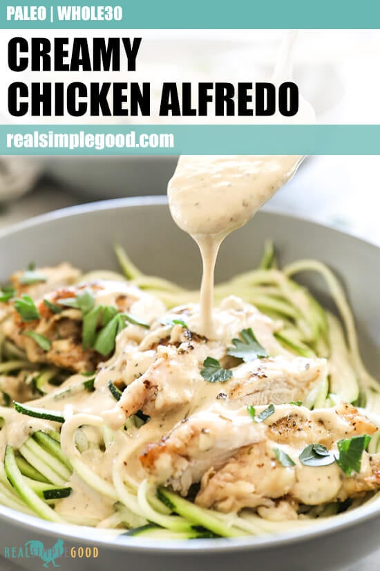 Close up angled image of spooning sauce over creamy chicken alfredo in a bowl with text overlay at top. 