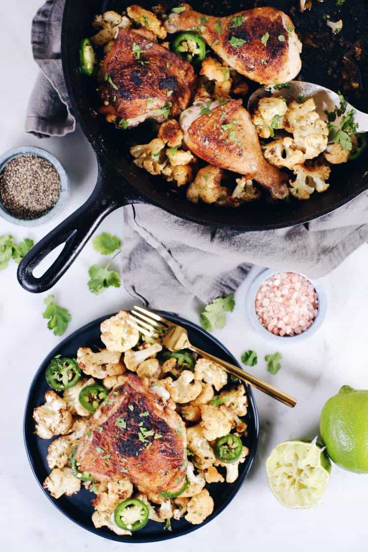 Crispy chicken thighs with zesty cauliflower are the perfect Paleo + Whole30 spicy meal. Packed with flavor, including citrus, cilantro and jalapeño! Paleo + Whole30. | realsimplegood.com