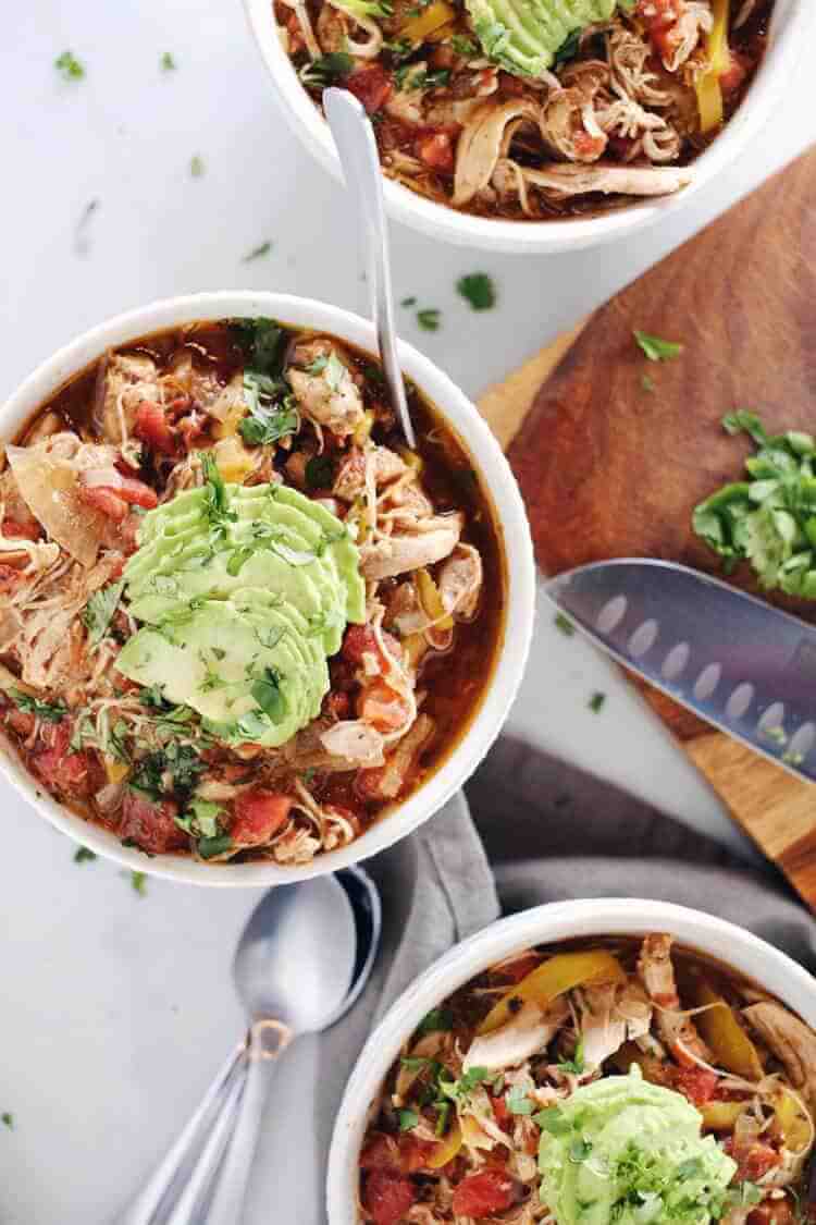 Crockpot Chicken Enchilada Soup overhead three bowls