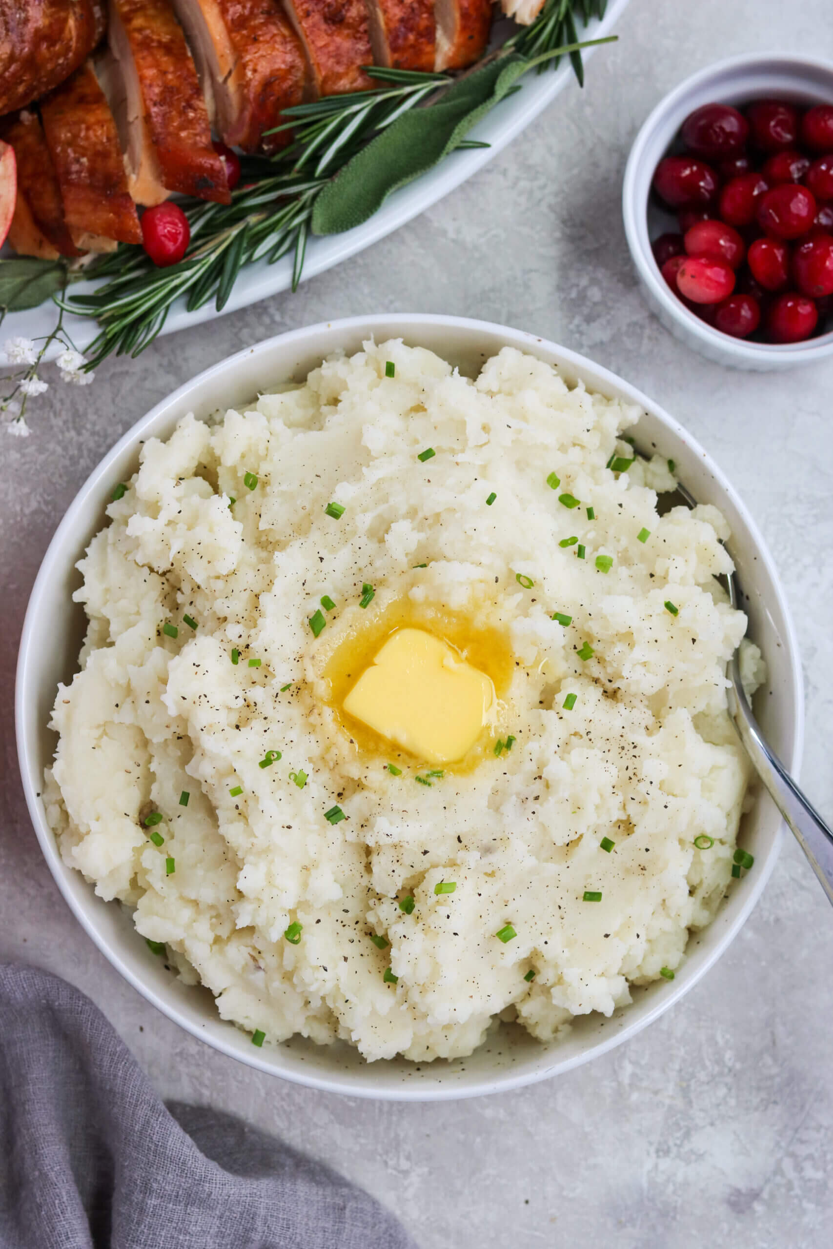 Dairy free mashed potatoes in a bowl with chopped chive topping