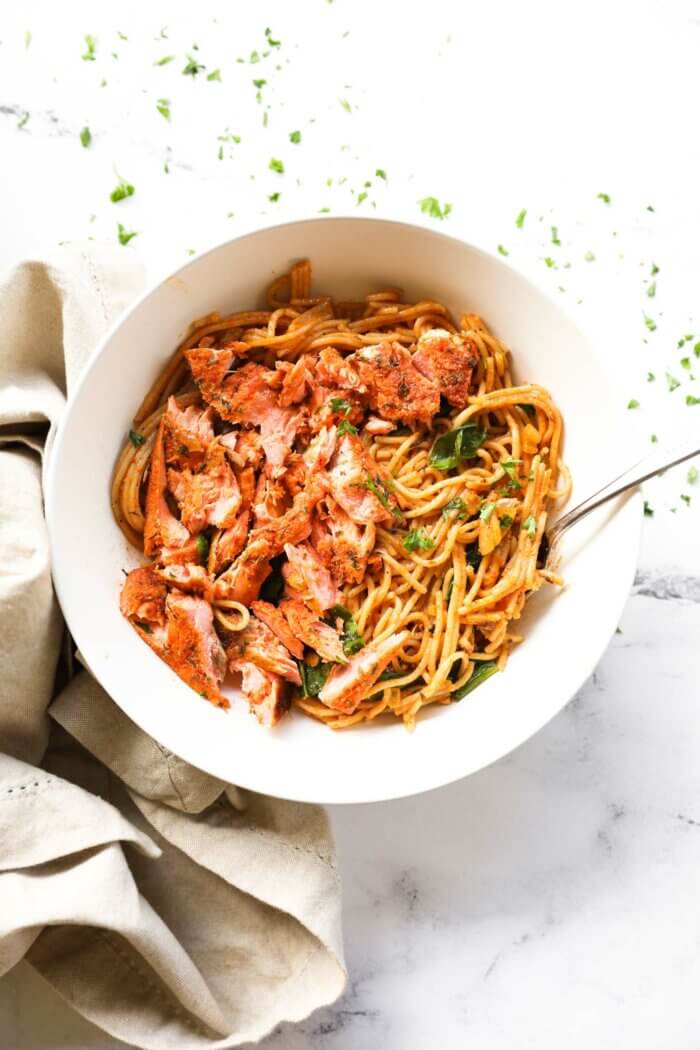 Cajun salmon shredded and served over creamy pasta.