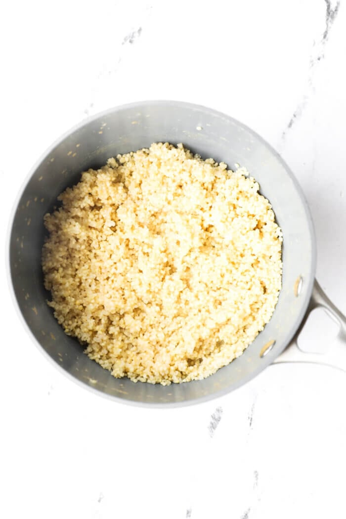 Fluffy millet in saucepan after liquid has absorbed.