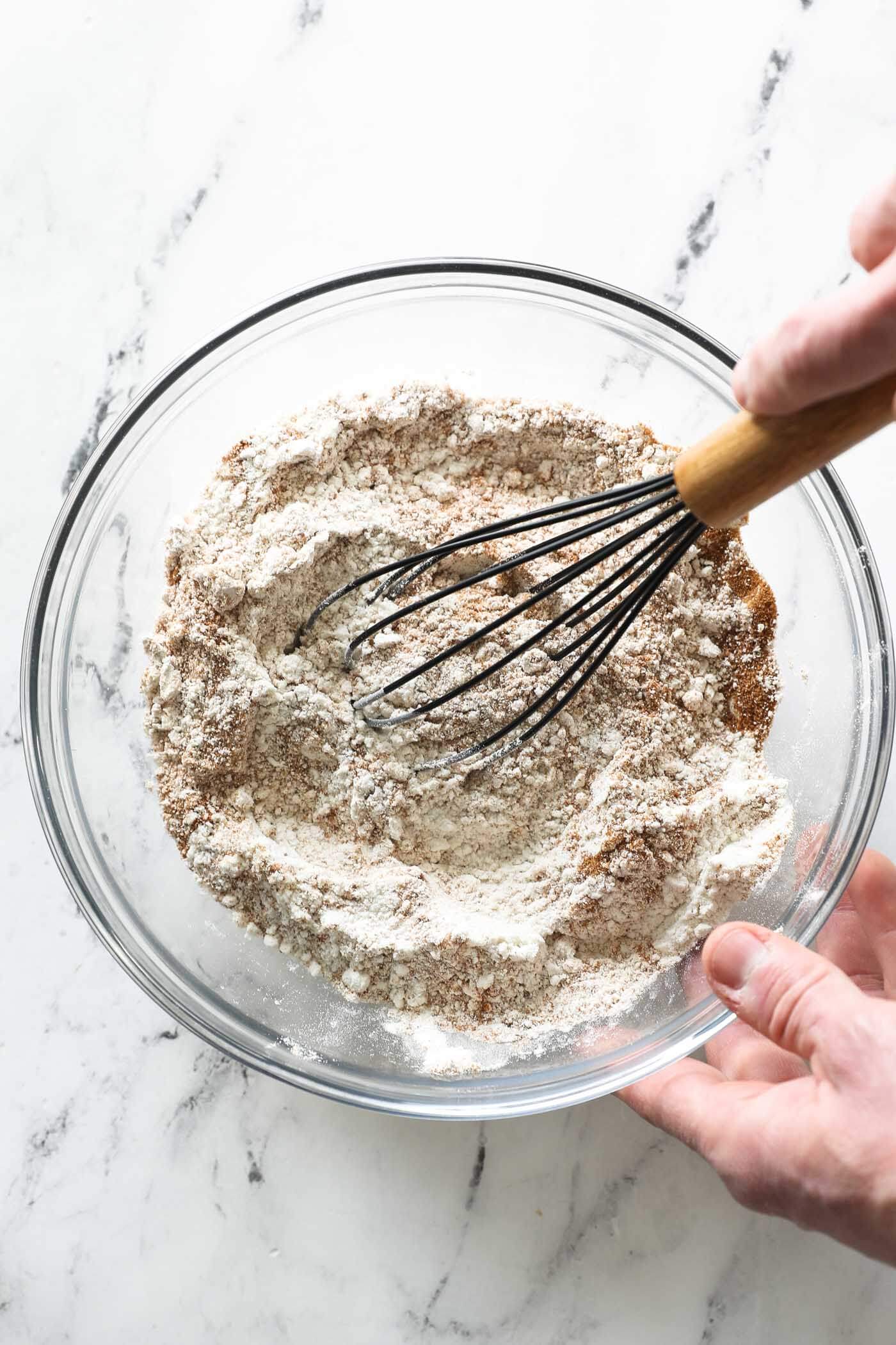 Whisking dry ingredients to make zucchini bread.