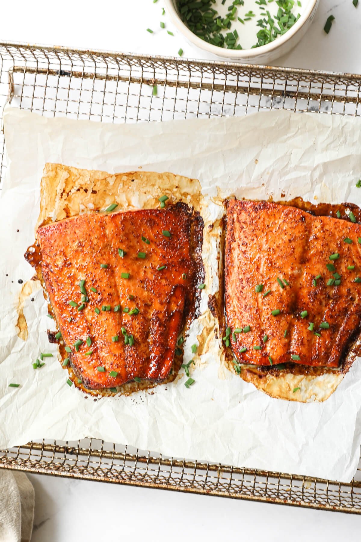 Close up overhead image of two pieces of air fried salmon.