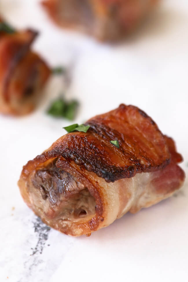 Close up of one bacon wrapped steak bite. 