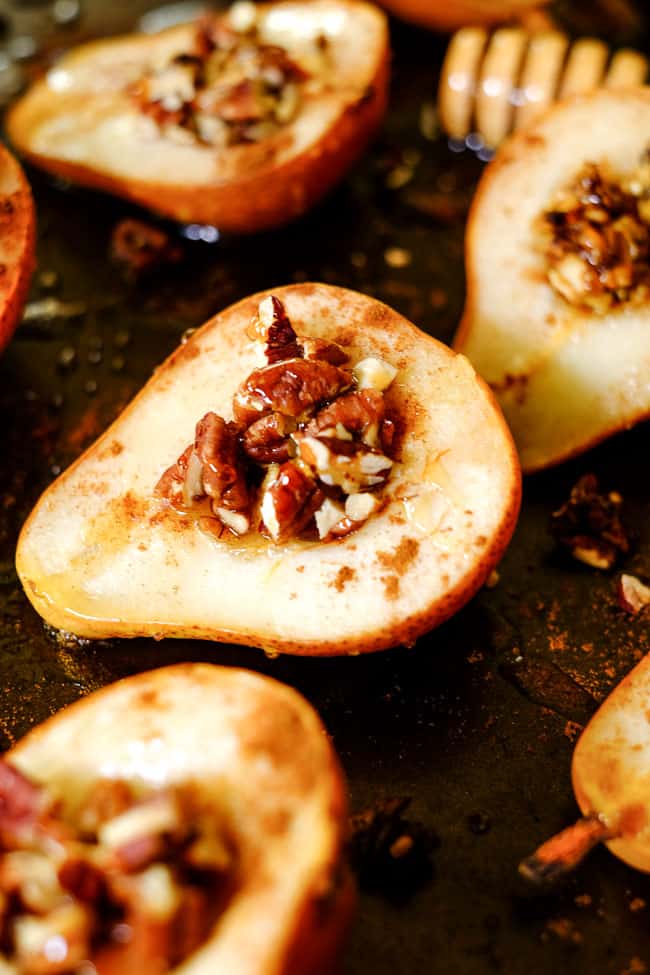 Easy baked pears on a cookie sheet with cinnamon, chopped nuts and honey. 