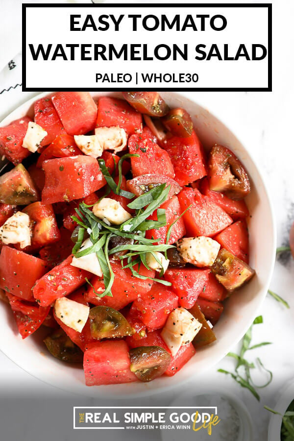 Close up of tomato watermelon salad in a bowl with fresh basil on top. Text overlay at top. 