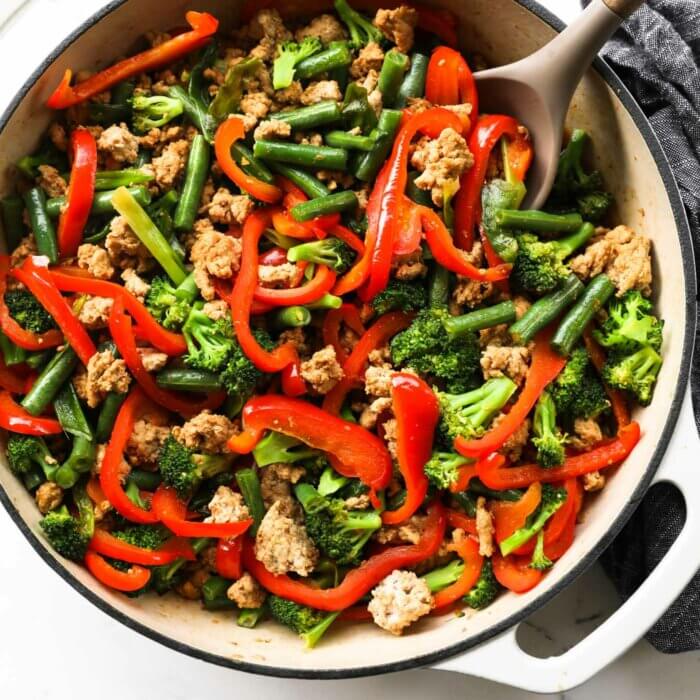 Overhead image of ground turkey teriyaki stir-fry with broccoli, bell pepper and green beans