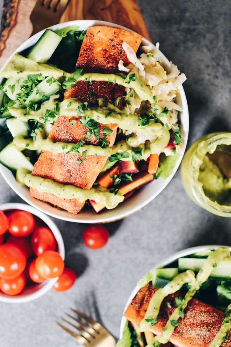 These easy Whole30 and Paleo Salmon Salad Bowls are the perfect way to sneak more salmon in and make a meal that you will absolutely look forward to making again! It's packed with healthy fats and colorful veggies your body will love! #paleolife #whole30meals #whole30 #healthyfats | realsimplegood.com