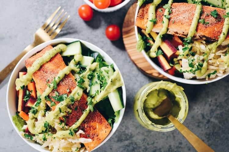 These easy Whole30 and Paleo Salmon Salad Bowls are the perfect way to sneak more salmon in and make a meal that you will absolutely look forward to making again! It's packed with healthy fats and colorful veggies your body will love! #paleolife #whole30meals #whole30 #healthyfats | realsimplegood.com