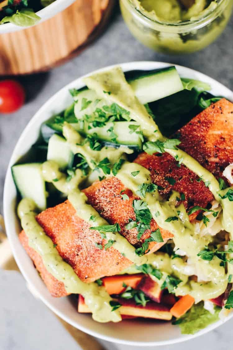 These easy Whole30 and Paleo Salmon Salad Bowls are the perfect way to sneak more salmon in and make a meal that you will absolutely look forward to making again! It's packed with healthy fats and colorful veggies your body will love! #paleolife #whole30meals #whole30 #healthyfats | realsimplegood.com