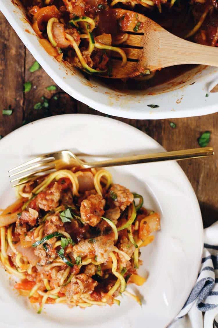 This Paleo and Whole30 easy zucchini casserole is packed with veggies and a breeze to make! It's filled with Italian sausage, bell peppers and onions! Paleo + Whole30 | realsimplegood.com