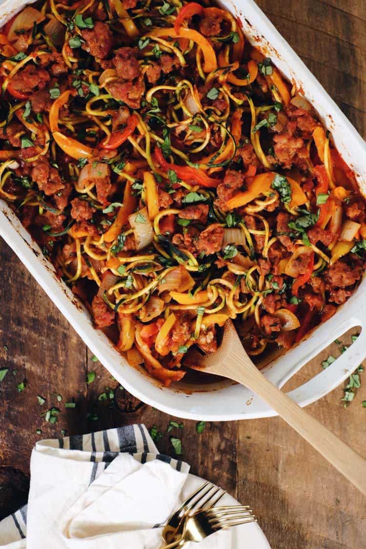 This Paleo and Whole30 easy zucchini casserole is packed with veggies and a breeze to make! It's filled with Italian sausage, bell peppers and onions! Paleo + Whole30 | realsimplegood.com