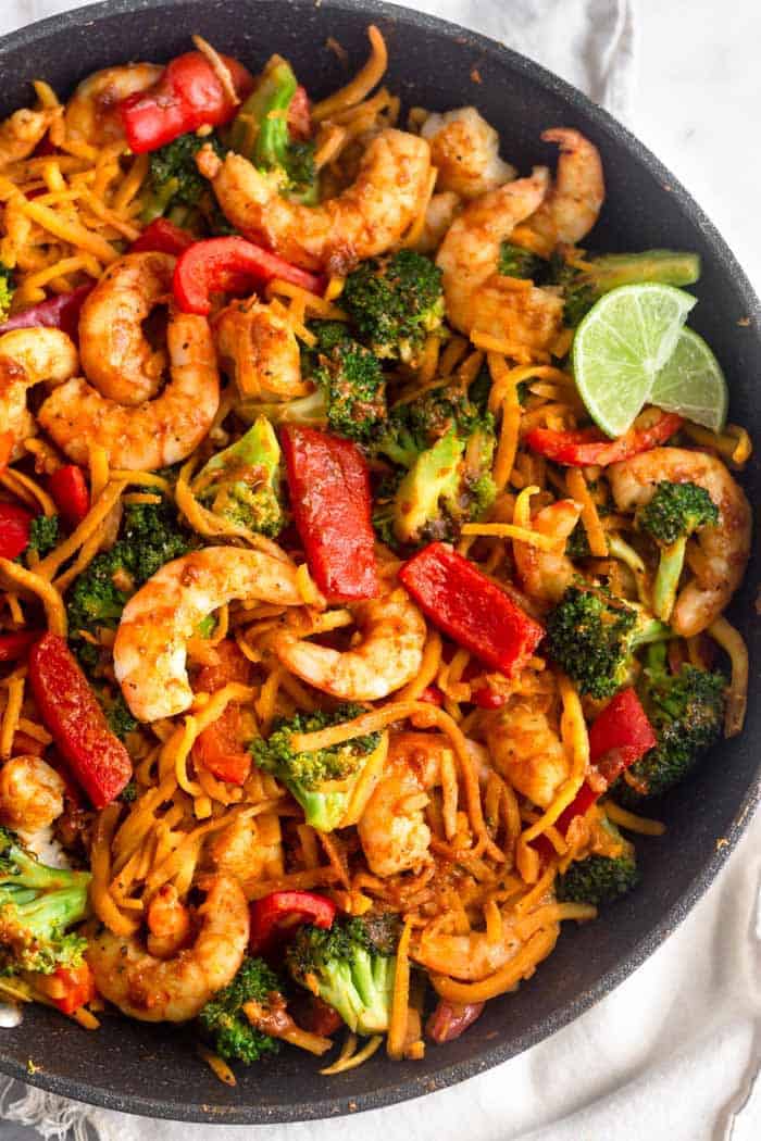 Shrimp and butternut squash noodles in a pan with broccoli and bell pepper