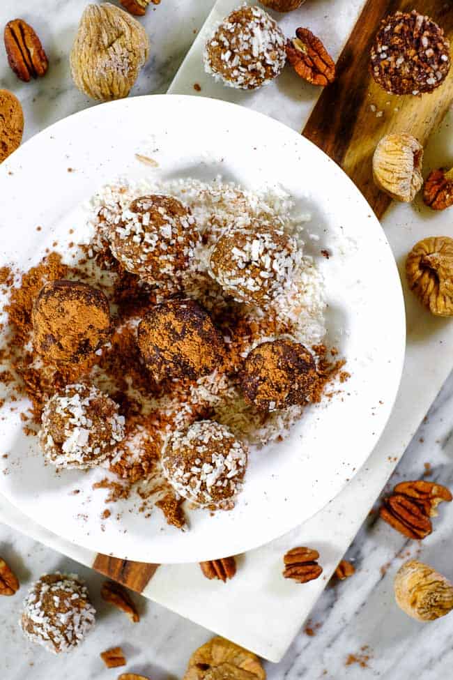 Fig and date bliss balls rolled in coconut and raw cacao with pecans and dried figs. 
