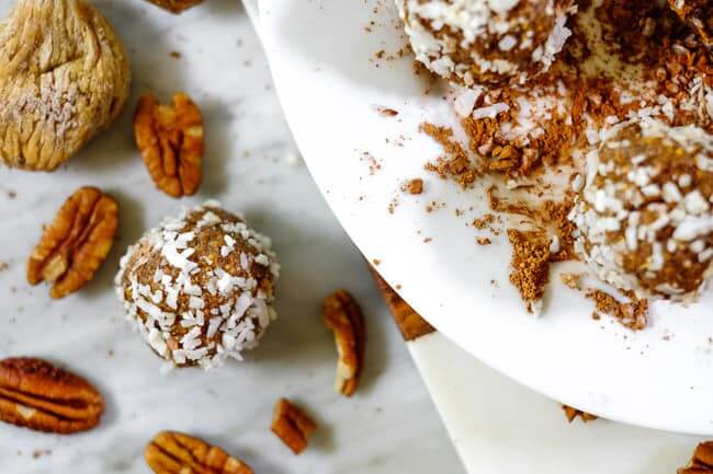 Fig and date bliss balls rolled in coconut with pecans and dried figs. 