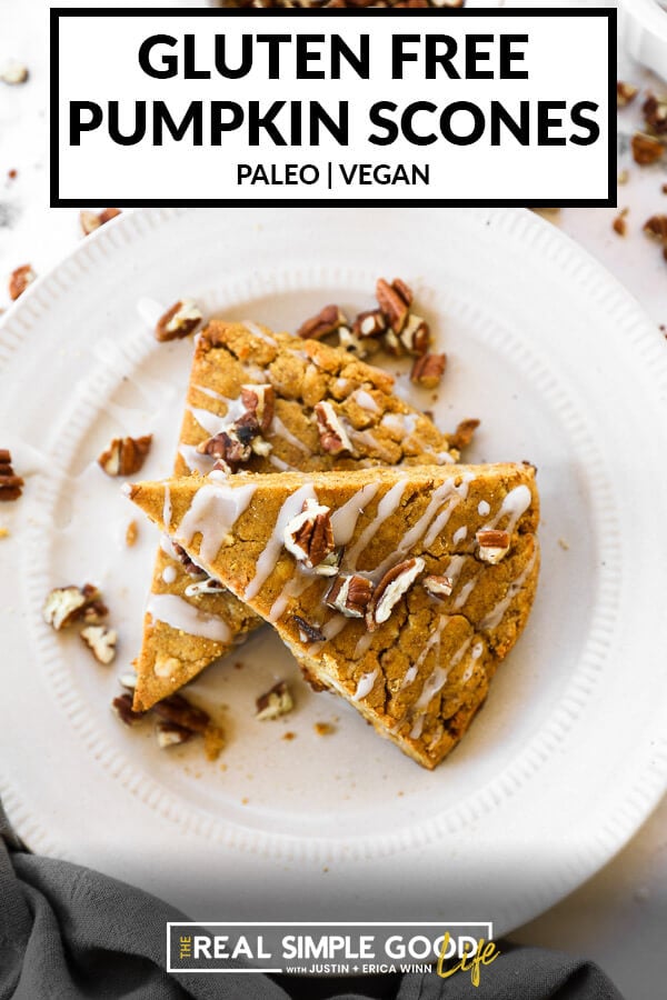 Vertical image with text overlay at the top. Image of two pumpkin scones on a plate with icing and chopped pecans on top. 