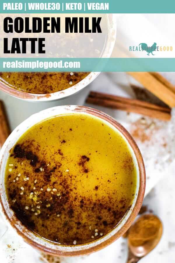 Close up shot of golden milk latte in a mug, sprinkled with cinnamon and hemp seeds. 