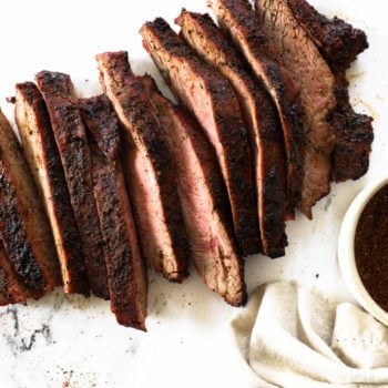 Overhead shot of sliced coffee rubbed steak on marble