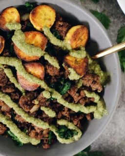 Ground beef and plantain bowls with green sauce on top