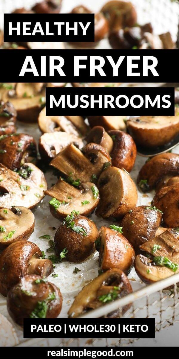 Vertical image with text overlay at the top. Close up angled image of air fryer mushrooms with buttery ghee mixture, fresh herbs and lemon juice. 