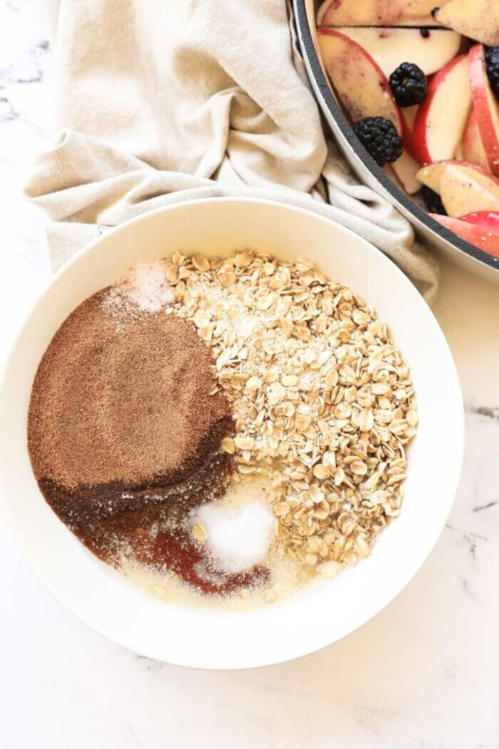 Overhead image of a bowl full of crumble ingredients before being mixed up.