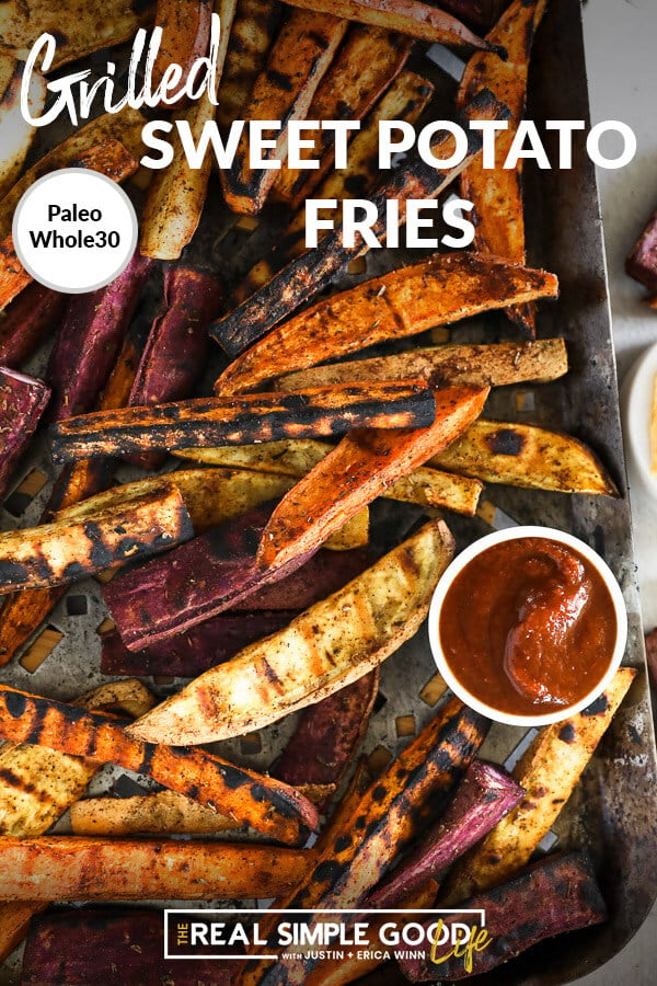 Vertical overhead image of grilled sweet potato fries on a grilling pan with a side of ketchup on the pan. Text overlay at top. 