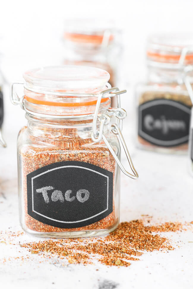 Homemade taco seasoning in a jar with lid and label