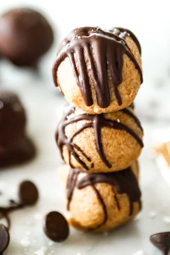 Three peanut butter balls stacked up. 