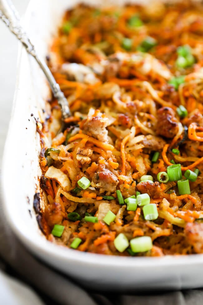 Healthy pork casserole in dish with spoon close up angle shot