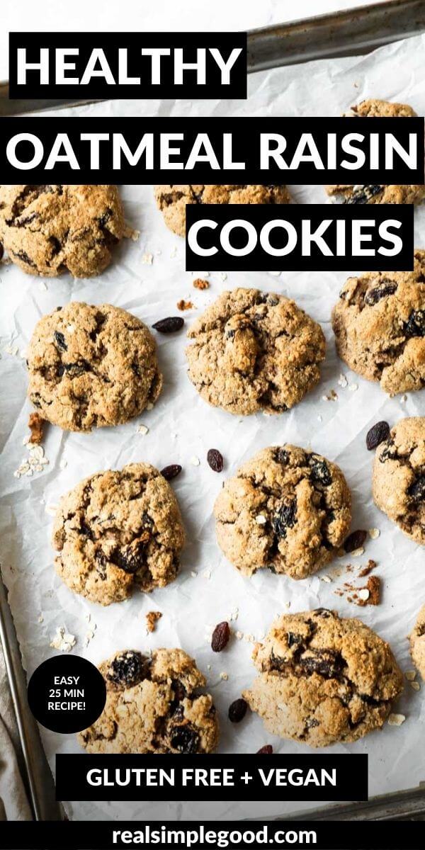 Vertical image with text overlay at the top. Vegan oatmeal raisin cookies are spread out on a baking sheet.