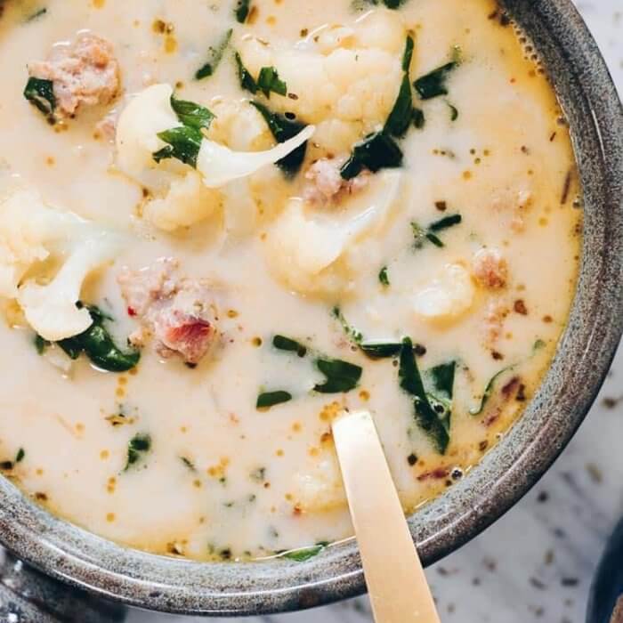 overhead image of healthy zuppa toscana in a pot with kale, sausage and cauliflower