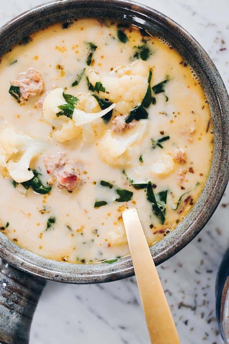 overhead image of healthy zuppa toscana in a pot with kale, sausage and cauliflower