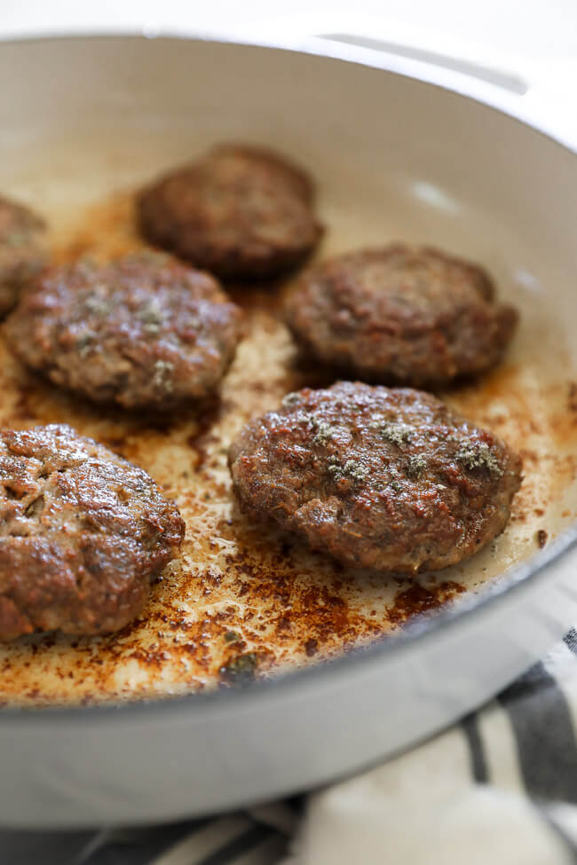 Homemade country breakfast sausage patties in a skillet. 