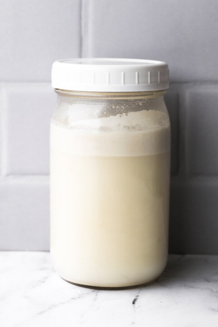 Coconut milk in a mason jar after the fat has separated to the top of the jar.