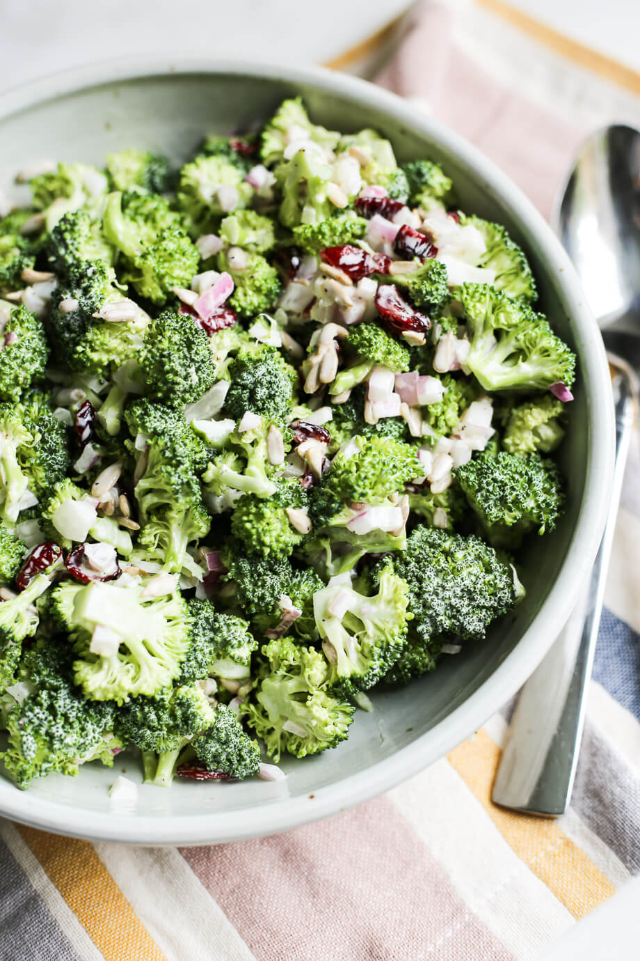 angle shot of broccoli salad in gray bowl