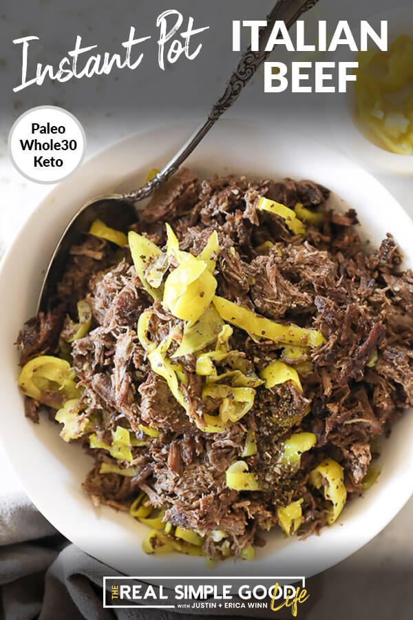 Instant pot italian beef shredded in a bowl with peppers and spoon vertical overhead image with text at top