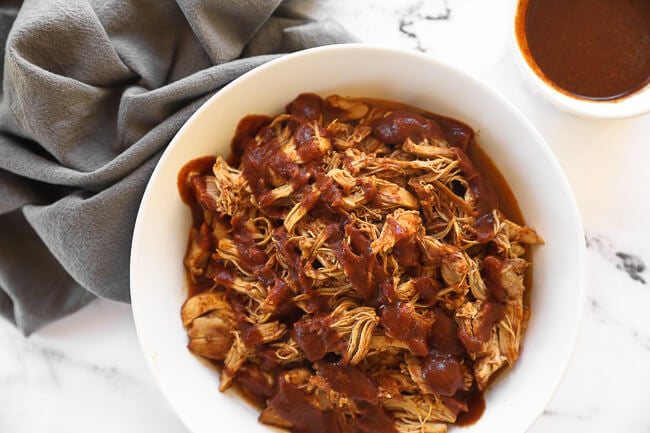 Shredded chicken topped with a drizzle of bbq sauce