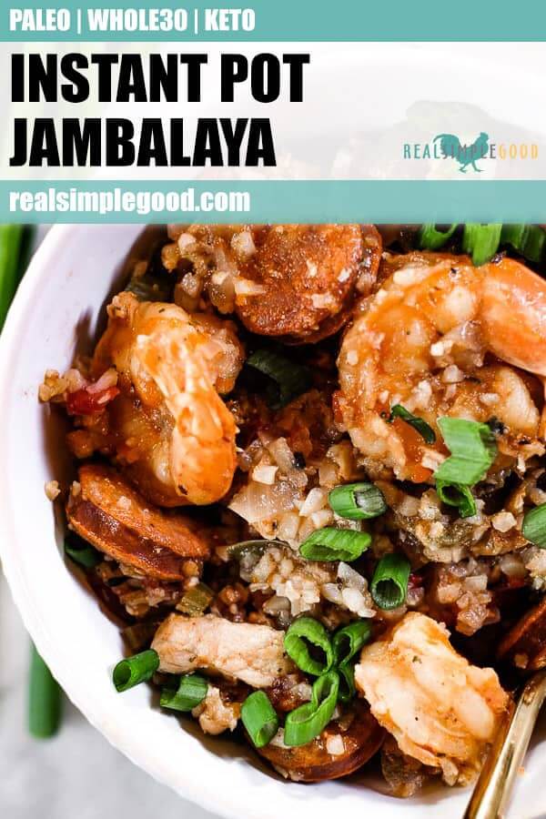 Close up of instant pot jambalaya served in a bowl with chopped green onion. 