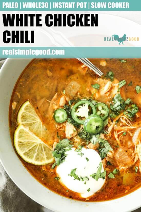 Instant pot white chicken chili vertical image with one bowl close up with toppings and spoon sticking out. Text at top of image for pinterest