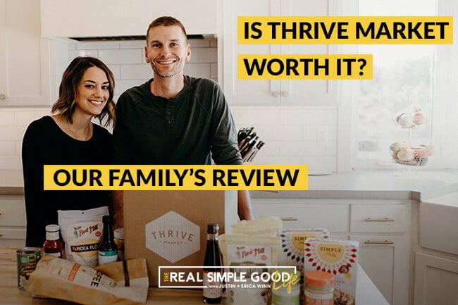 Justin and Erica Winn in the kitchen with Thrive market box and food products on the counter