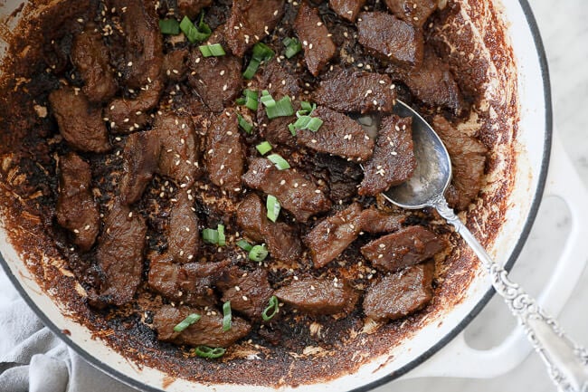 Korean beef bulgogi in pan with spoon horizontal image