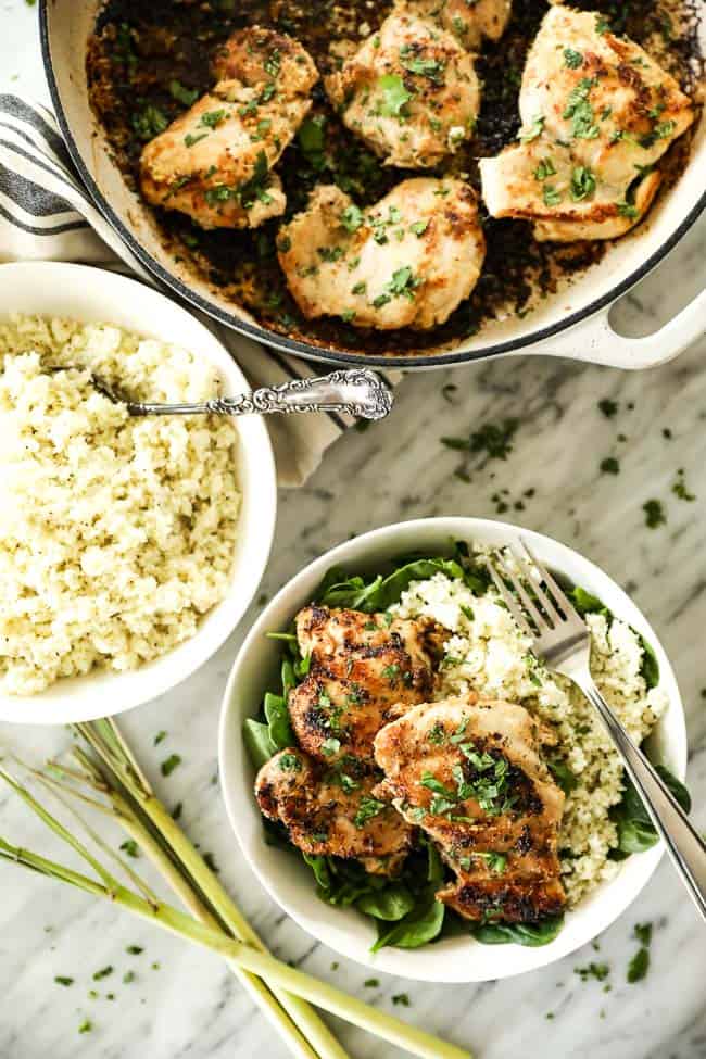 Image of lemongrass chicken in skillet with a bowl of cauliflower rice with a serving spoon and then a bowl with greens, cauliflower rice and chicken. 